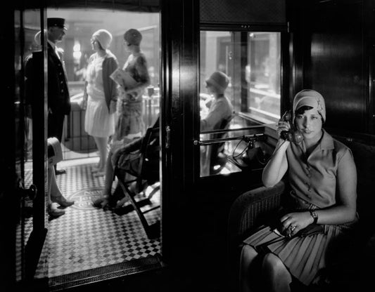 Woman on telephone in observation car, 1929