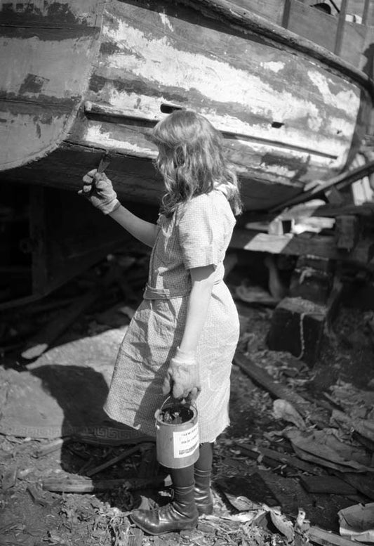 Girl Caulking Hull, 1920